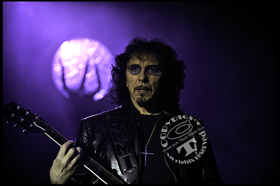 Tony Iommi glides over the frets of the guitar neck